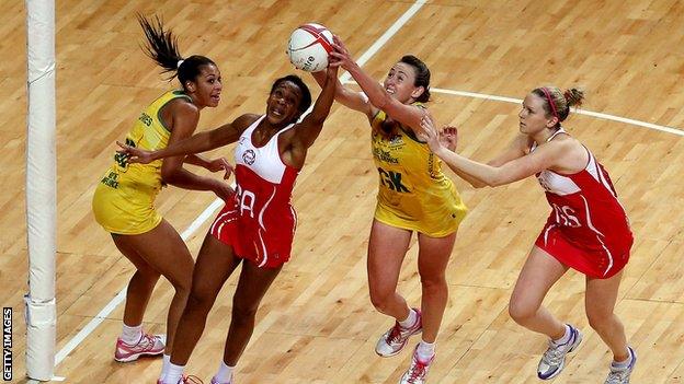 Pamela Cookey of England beats Rebecca Bulley of Australia to the ball