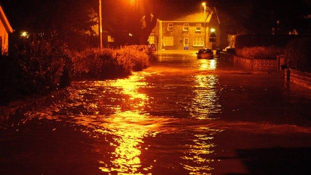 Floodwater on the road in Llanddowror