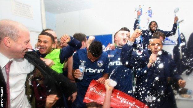 Oldham's players celebrate their win over Liverpool which earned them a tie against Everton