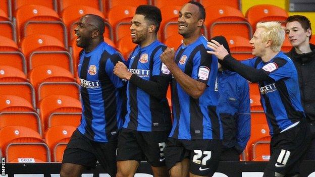 Jason Scotland (left) celebrates scoring for Blackpool