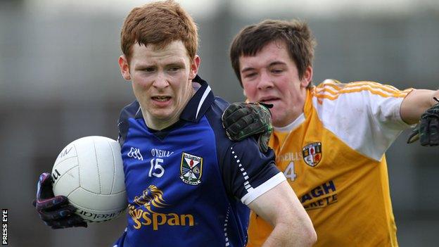 Antrim defender Niall Delargy challenges Cavan's Niall McDermott