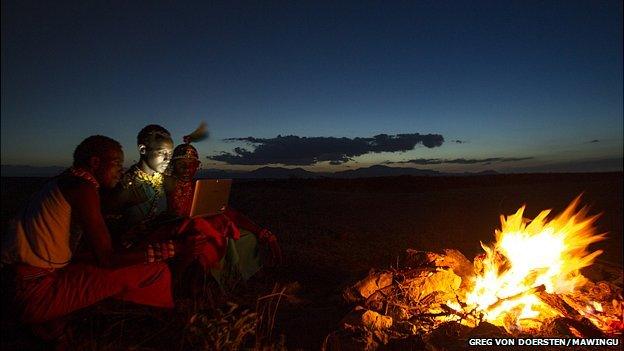 Using a computer by firelight