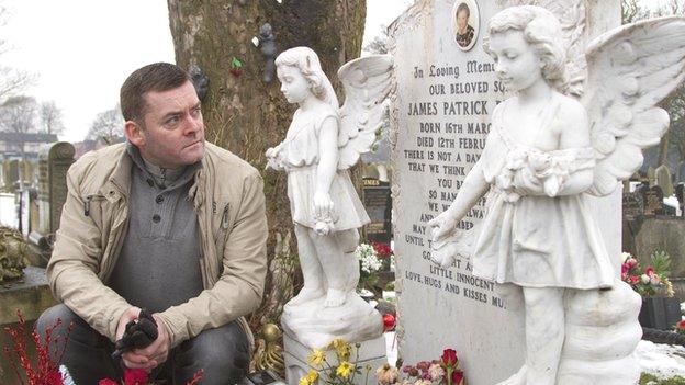 Ralph Bulger at the graveside of his son, James