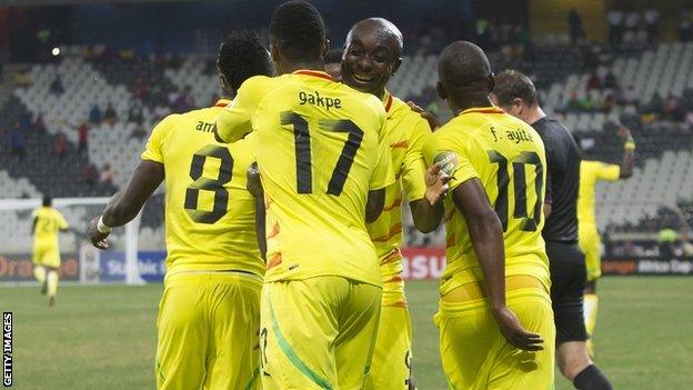 Togo players celebrate scoring against Tunisia