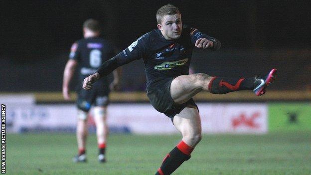 Dragons wing Tom Prydie slots a kick