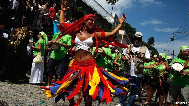 A reveller dances during the annual block party known as Carmelitas in Rio de Janeiro, 8 February 2013