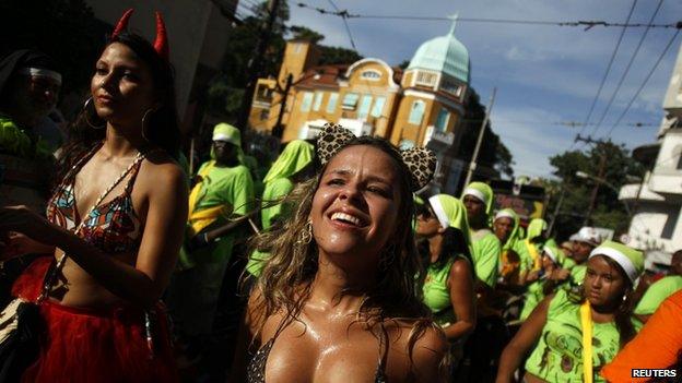 A reveller dances during the annual block party known as Carmelitas in Rio de Janeiro, 8 February 2013