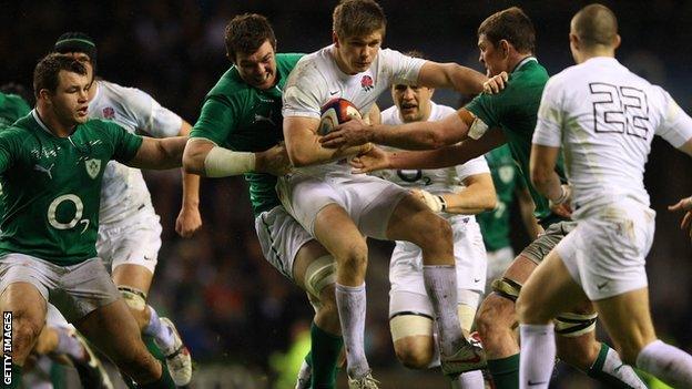 Owen Farrell is tackled by Peter O'Mahony