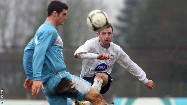 Ballymena striker Gary Liggett in action against Ryan McIlmoyle of Coleraine