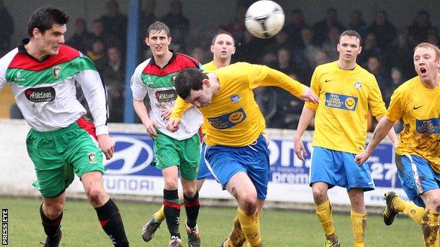 Jimmy Callacher heads Glentoran's equaliser away to Bangor