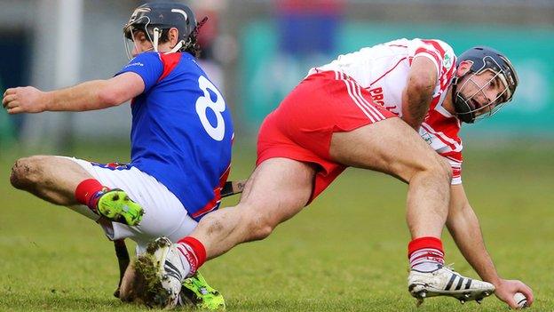 St Thomas' Kenneth Burke and Barney McAuley of Loughgiel Shamrocks