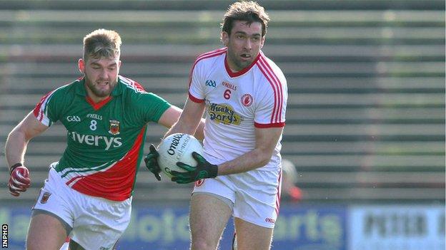 Mayo's Aidan O'Shea attempts to dispossess Joe McMahon of Tyrone