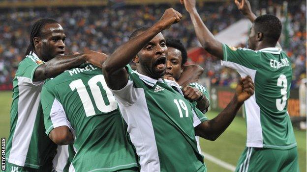 Nigeria's Sunday Mba (centre) celebrates after scoring against Burkina Faso