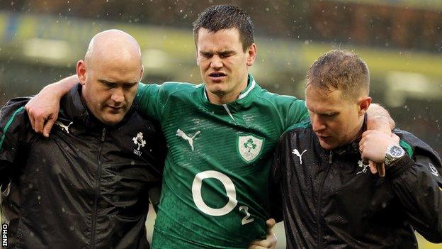 Jonathan Sexton is helped off during Sunday's defeat by England