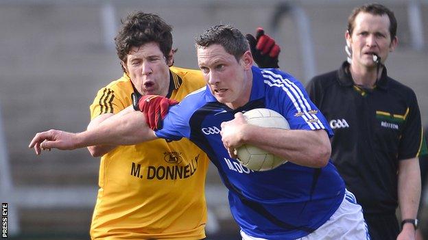 Ulster's Sean Cavanagh battles with Munster's Gary Hurney