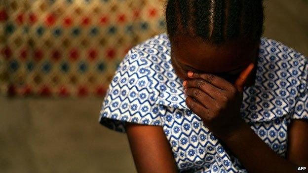 DR Congo rape victim talking to health worker