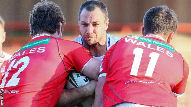 Adrian Morley is tackled by Ben Evans and Rhodri Lloyd