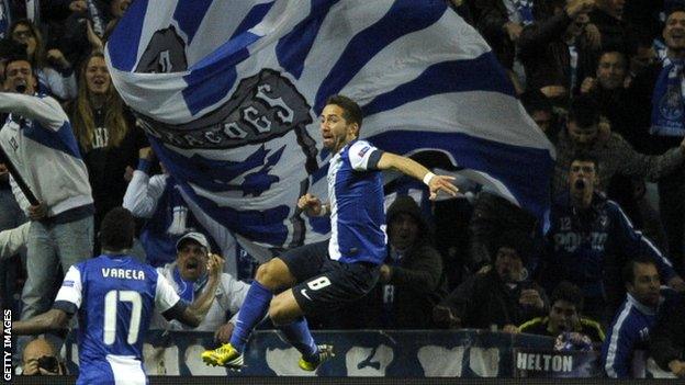 Joao Moutinho celebrates scoring against Malaga