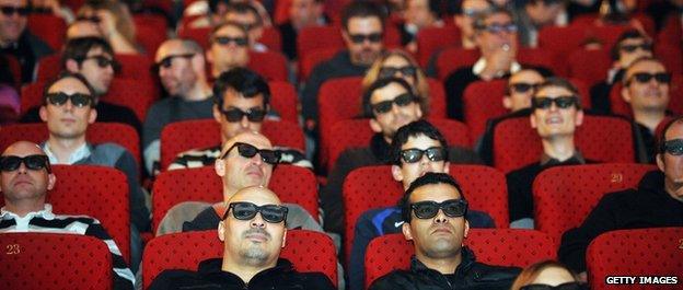 Fans watch on a screen with 3D glasses the Six Nations rugby union tournament final