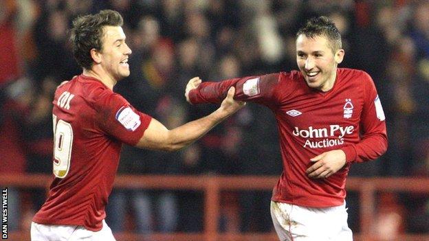 Radoslaw Majewski (right) is congratulated by Simon Cox