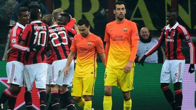 Milan celebrate scoring against Barcelona