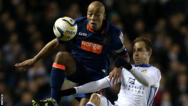 Leeds United's Luke Varney and Blackpool's Alex Baptiste (left)