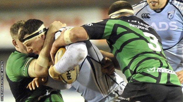 Robin Copeland of Cardiff Blues, centre, is tackled by Connacht's Michael Swift and Andrew White