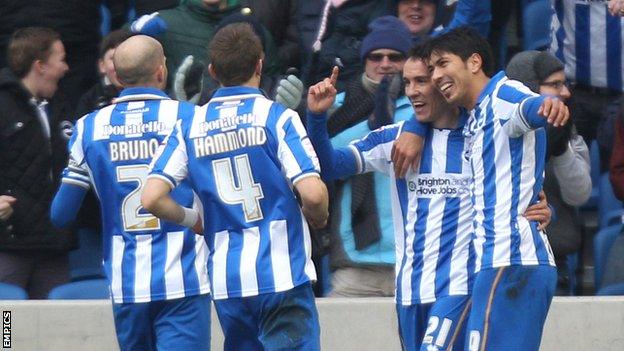 Leonardo Ulloa (r) and David Lopez (second r) celebrate Lopez's goal