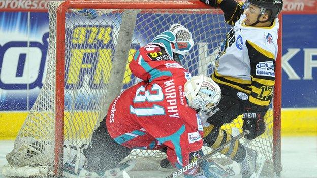 Matt Francis of the Nottingham Panthers crashes into Stephen Murphy of the Belfast Giants