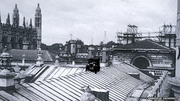 Austin Seven van on top of Cambridge University's Senate House