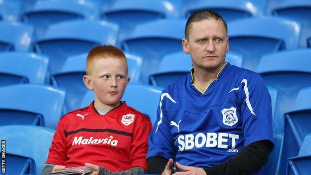 Cardiff City fans wearing contrasting club shirts