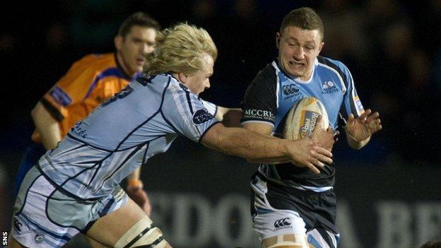 Cardiff Blues' Luke Hamilton tackles Glasgow Warriors' Duncan Weir