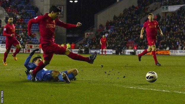 Luis Suarez scores his third for Liverpool