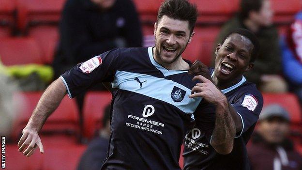 Burnley striker Charlie Austin (left)