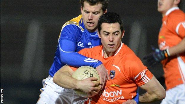 Aidan Rowan tackles Aaron Kernan at the Athletic Grounds