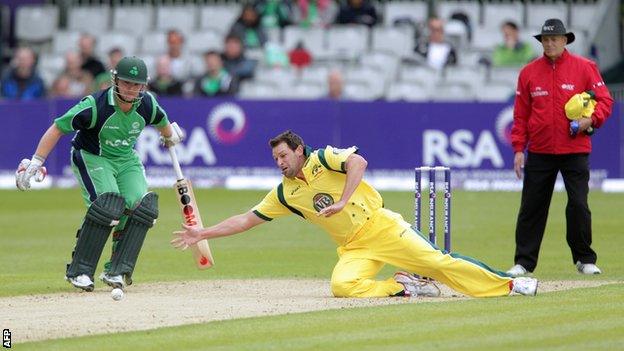 Australian bowler Ben Hilfenhaus dives for the ball against Ireland at Stormont last year