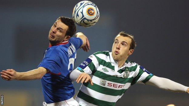 Linfield's Jim Ervin beats Karl Sheppard to the high ball