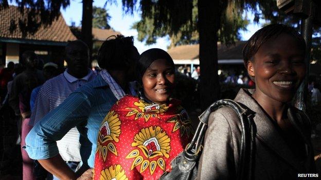People queue at a polling station in the Nairobi district of Kibera