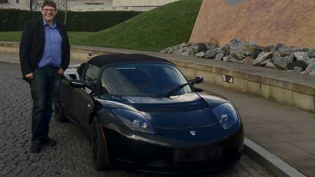 Andrew Bissell drives a Tesla roadster