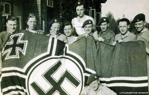 30AU posing with a captured German flag