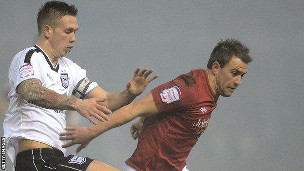 Simon Cox of Forest and Ipswich's Luke Chambers