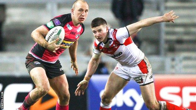 St Helens centre Mark Percival (right) in action against Leeds Rhinos