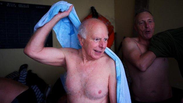 A clevedon sea swimmer dries off with a towel.