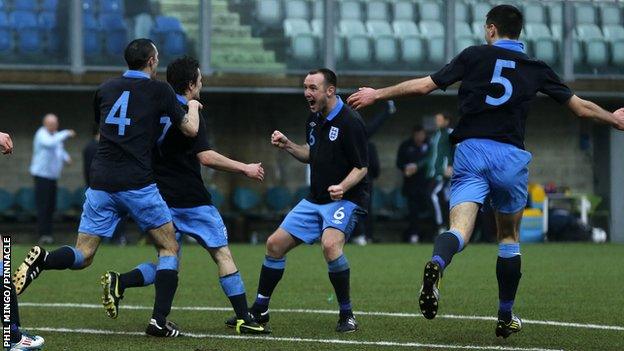 Jersey captain Luke Watson celebrates Jamie Savory's goal