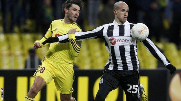 Anzhi Makhachkala"s Yuri Zhirkov (L) with Newcastle United"s Gabriel Obertan