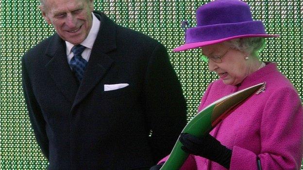 The Queen and the Duke of Edinburgh examine the baton at the launch of the relay for the Melbourne 2006 games