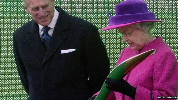 The Queen and the Duke of Edinburgh examine the baton at the launch of the relay for the Melbourne 2006 games