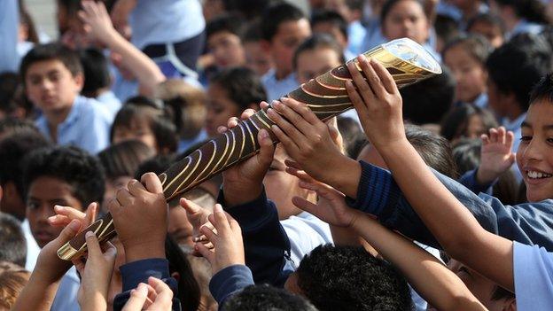 Pupils of Chapel Downs Primary School, Auckland, New Zealand, pass the baton around as part of the Delhi 2010 rela