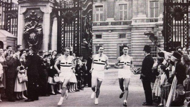 L-R Chris Brasher, Roger Bannister (with baton) and Chris Chataway at Buckingham Palace.