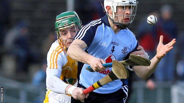 Benny McCarry challenges Dublin's Ruairi Trainor at Casement Park